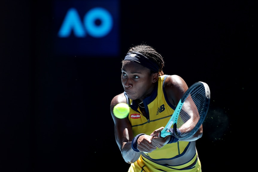 Coco Gauff plays a double-fisted backhand at the 2024 Australian Open.