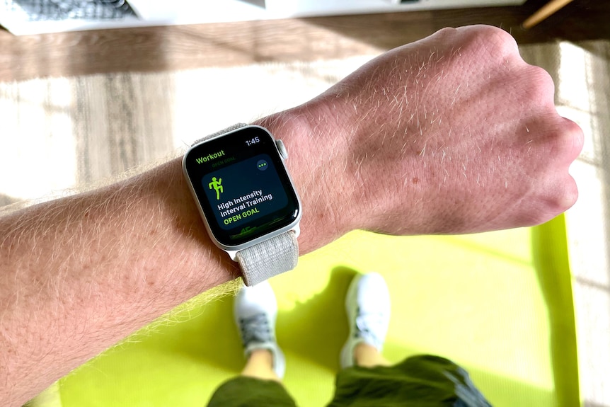 a male wrist with an apple watch attached with the screen displaying the 'high intensity workout' function