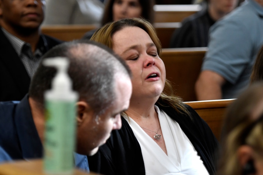 Kyle Rittenhouse's mother reacts with tears as her son is found not guilty.
