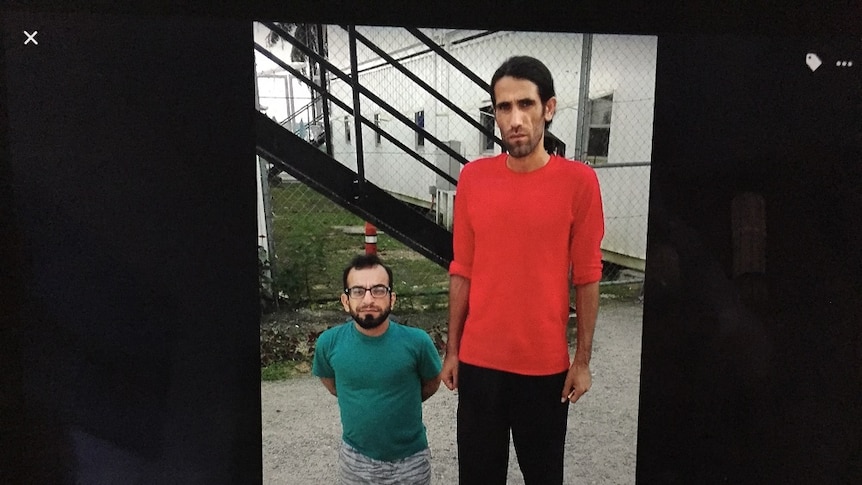 Two Manus Island refugees standing in the detention centre.