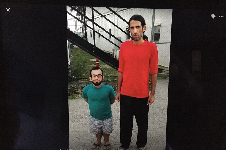 Two Manus Island refugees standing in the detention centre.