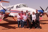 RFDS plane and members of the Bates, Barlow and Colley families at the Packsaddle landing strip