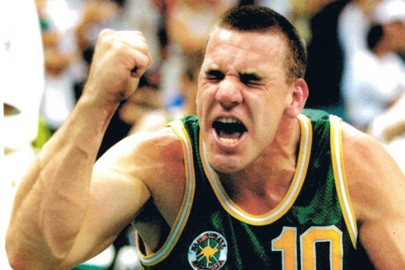 An Australian male Paralympic wheelchair basketball players pumps his fist during a game in the 1990s.