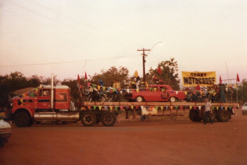 Historic image of the Derby Motocross Club taking part in a parade.