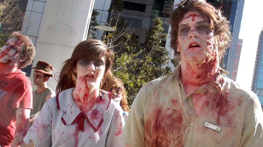 Zombies march through the streets of the Brisbane CBD.