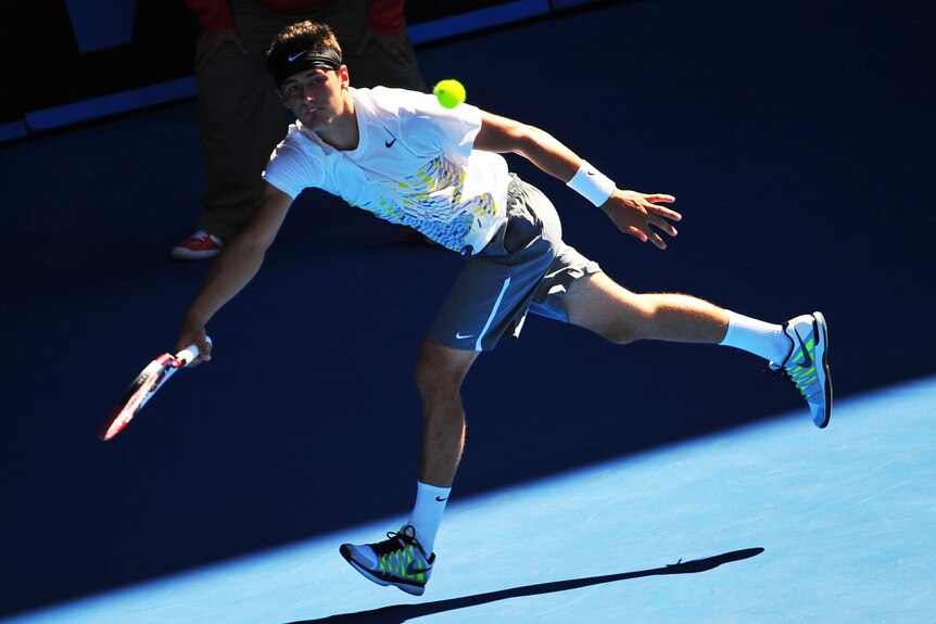 Bernard Tomic runs to return during his five set win over Fernando Verdascoin.