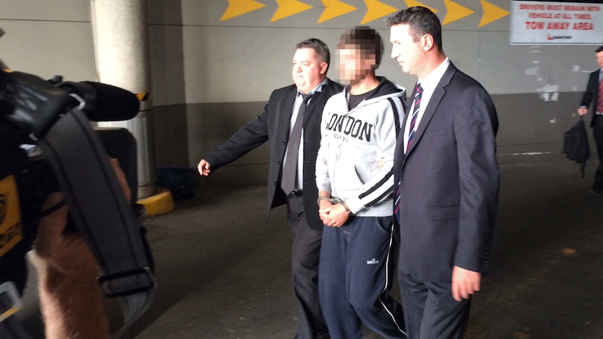 Alleged bikie associate arrives at Brisbane airport from South Australia. Tues May 13, 2014