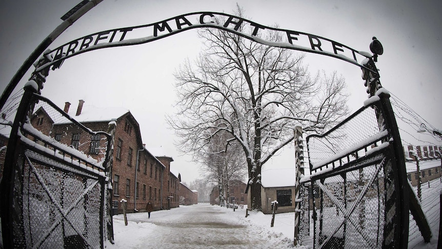 The entrance to the former Nazi concentration camp Auschwitz-Birkenau with the words "Arbeit macht frei" ("Work makes you free").