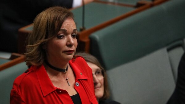Close up of Labor MP Anne Aly crying in Parliament after colleagues unite behind multiculturalism