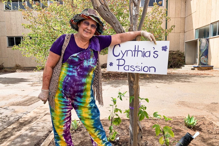 Cynthia Bubner next to a small tree