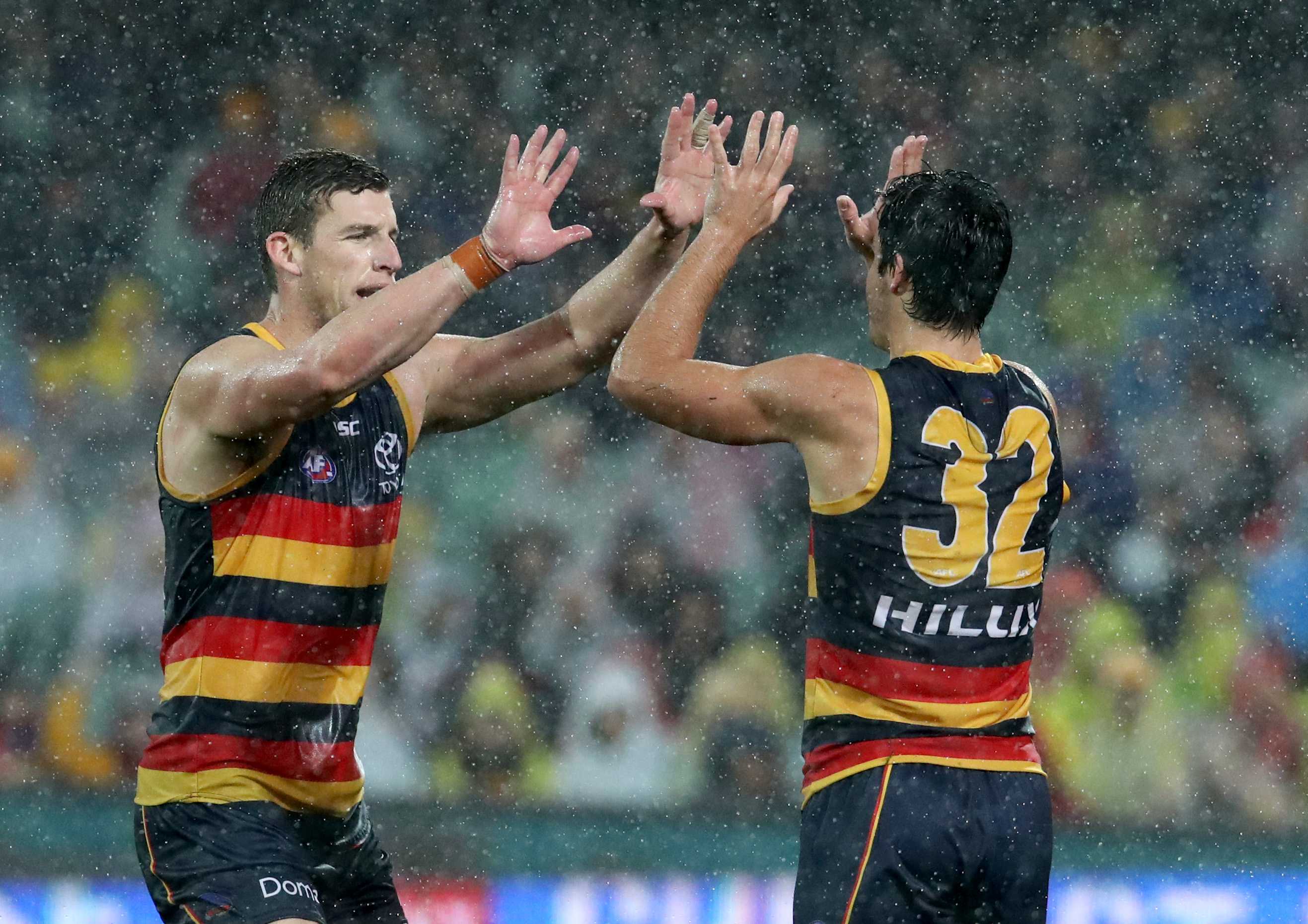 Josh Jenkins and Darcy Fogarty give each other a high five during the Crows' encounter against the Bulldogs.