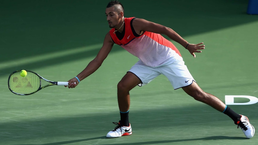 Australia's Nick Kyrgios plays forehand return against Tomas Berdych in Dubai on February 25, 2016.