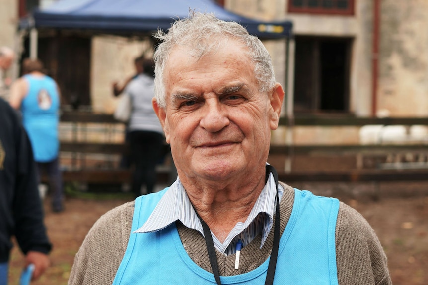 Lance Degahardt smiles outside the Glencoe woolshed.