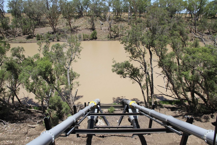 Two large pumping pipes going into the Dawson River