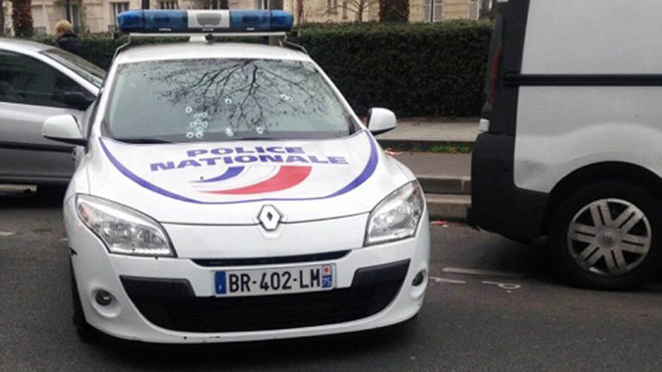 A police car riddled with bullets from a shootout outside the offices of the newspaper Charlie Hebdo . (Photo: AFP/STR)