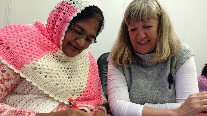 Tahira Tasmeen in an English class with teacher Susan Murphy.