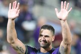Melbourne Storm captain Jesse Bromwich holds up his hands after winning the NRL season opener over South Sydney.