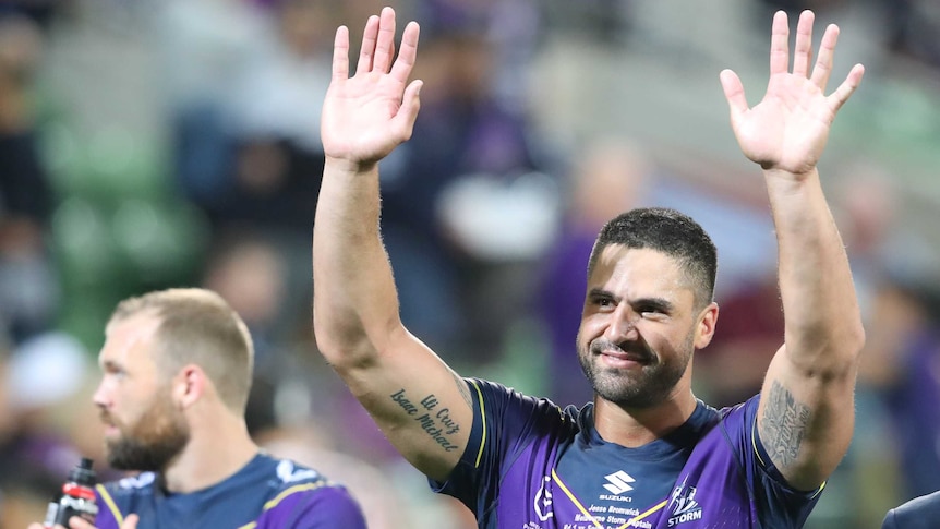 Melbourne Storm captain Jesse Bromwich holds up his hands after winning the NRL season opener over South Sydney.