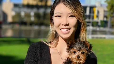 Emily Unity with her pet dog in a story about when and how to talk about your mental health in a new relationship.