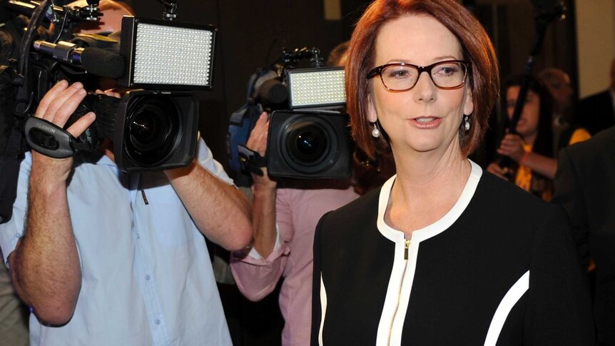 Julia Gillard surrounded by media (Australia Network News)