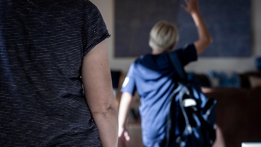 Boy walking away angry from his parent