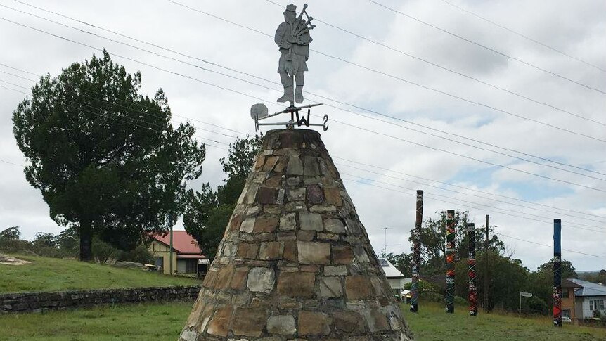 Maclean Cairn with the Chiefs tartan poles in the background.