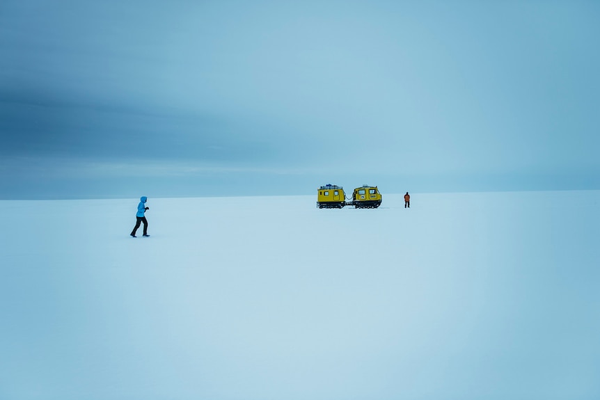Marathon runner Mina Guli running across snow in the Antarctic.