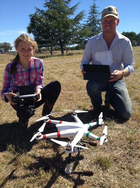 Molong wool producer Ben Watts and his daughter Alyssa with the multicopter
