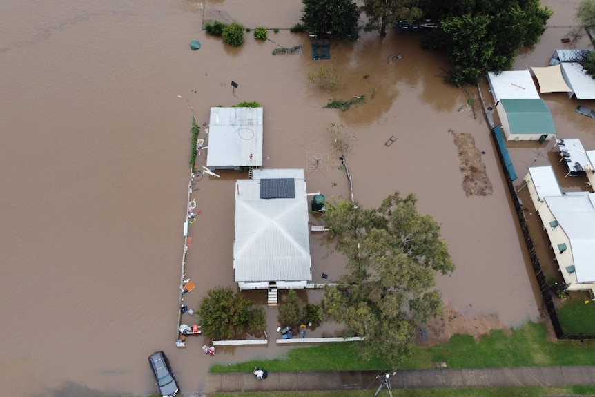 aerial view of home inundated with water 