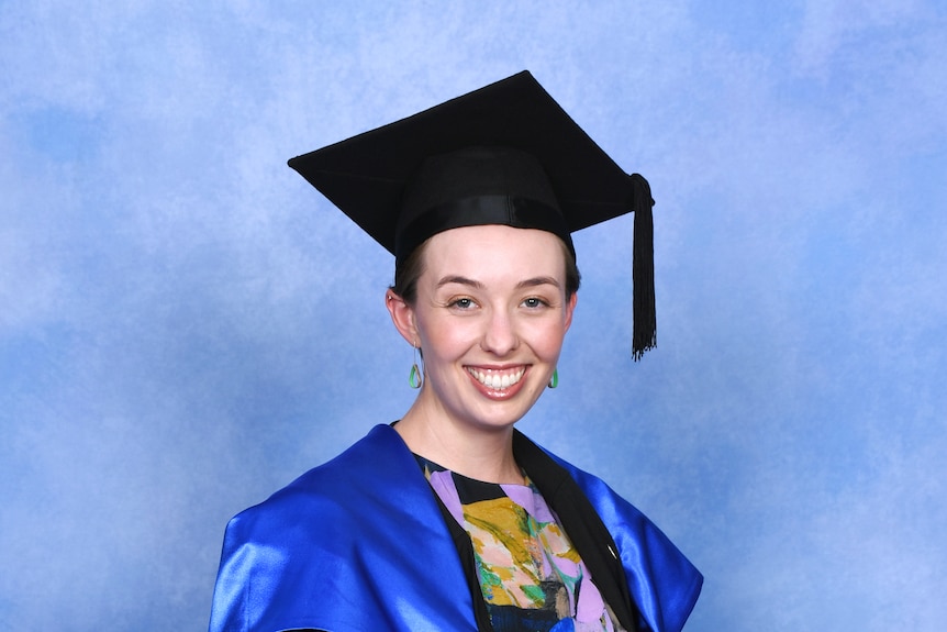 A young woman with a graduation cap.