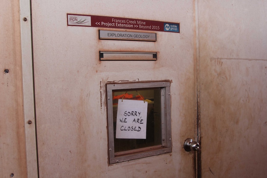 an office door with a sign reading "sorry, we are closed"