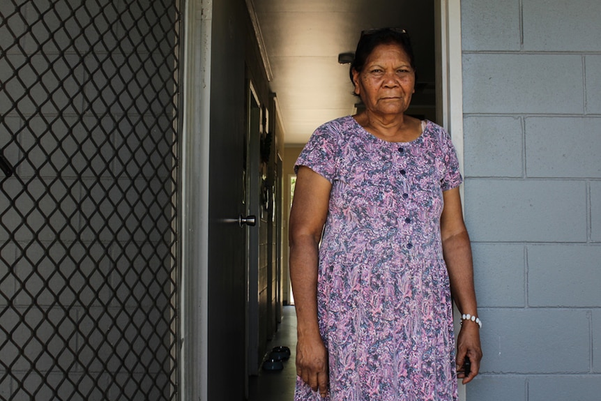 Photo of Murri Elder Evelyn Neade taken in her front doorway in Mount Isa