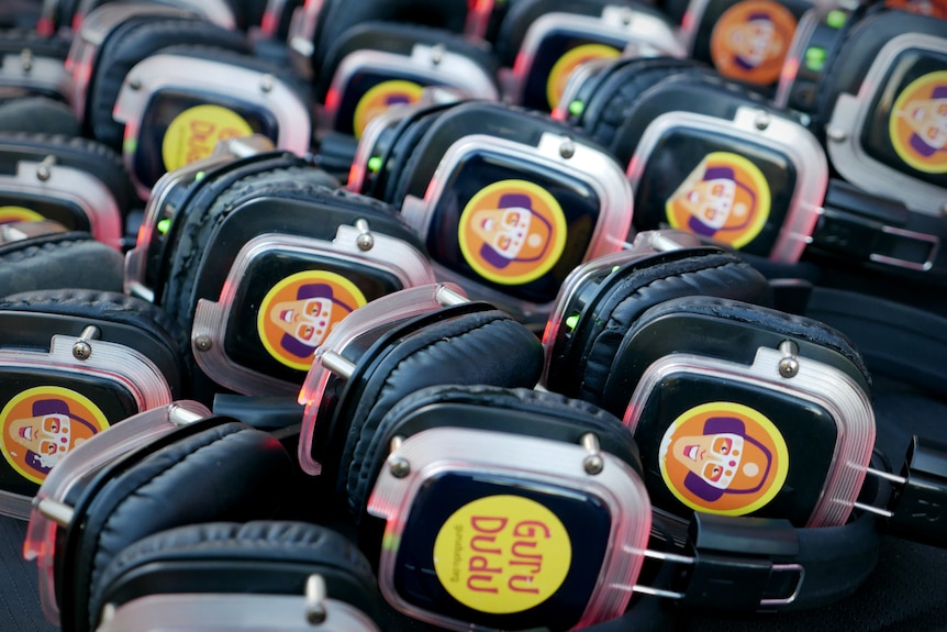 A collection of headphones with colourful stickers