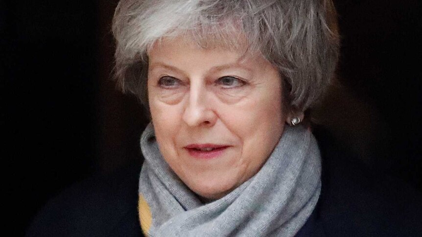 Britain's Prime Minister Theresa May looks solemn as she leaves Downing Street.