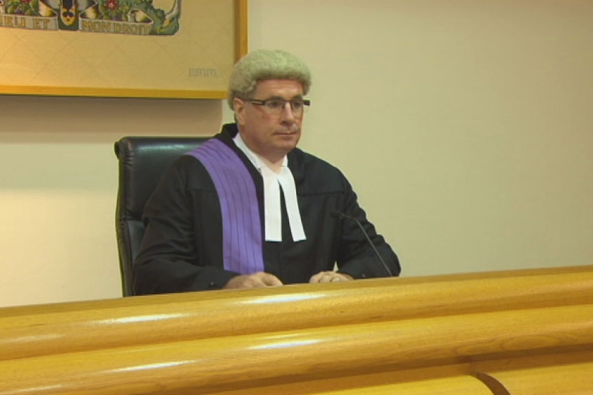 Judge Paul Slattery sits at the bench in a courtroom.