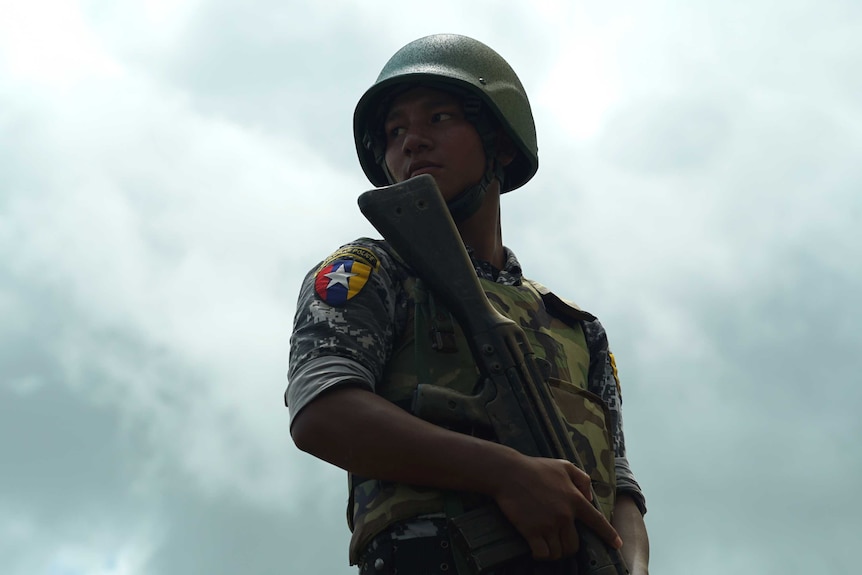 A young soldier holds a rifle in Rakhine region of Myanmar.