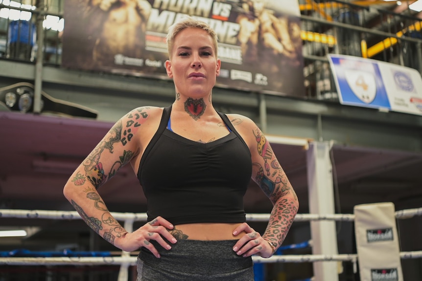 Bec Rodriguez standing with hands on hips in a boxing ring in Brisbane.