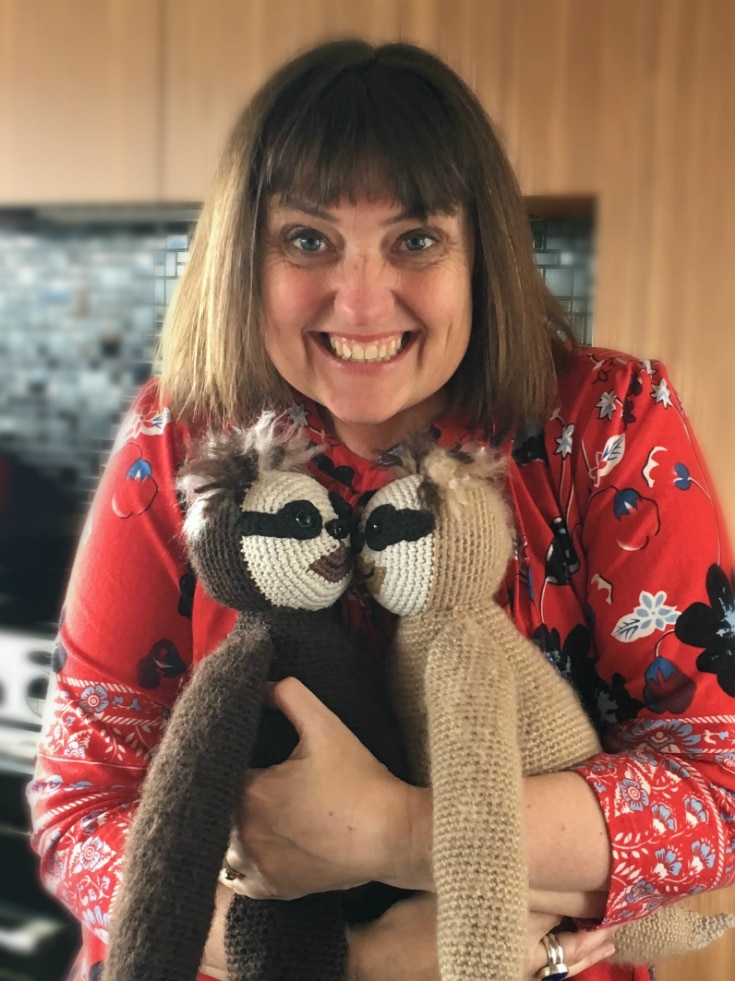 Lucy Ward holding crocheted sloths