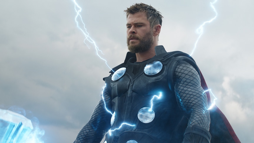 Colour still of Chris Hemsworth with lightning streaks emanating from his armour in 2019 film Avengers: Endgame.