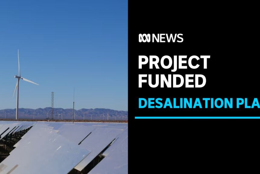 Project funded, Desalination Plant: Solar panels are seen in the foreground with a wind turbine and hills seen in the background