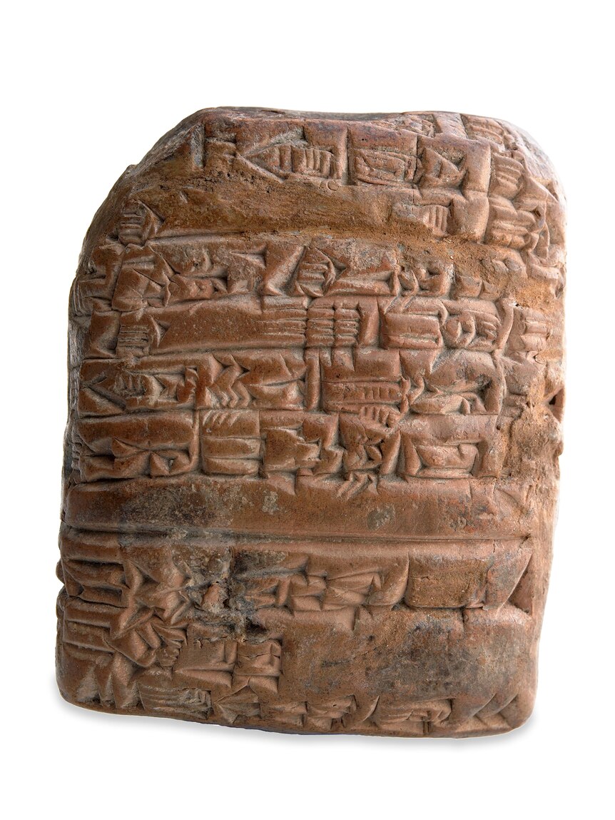 A stone tablet with carvings on it.