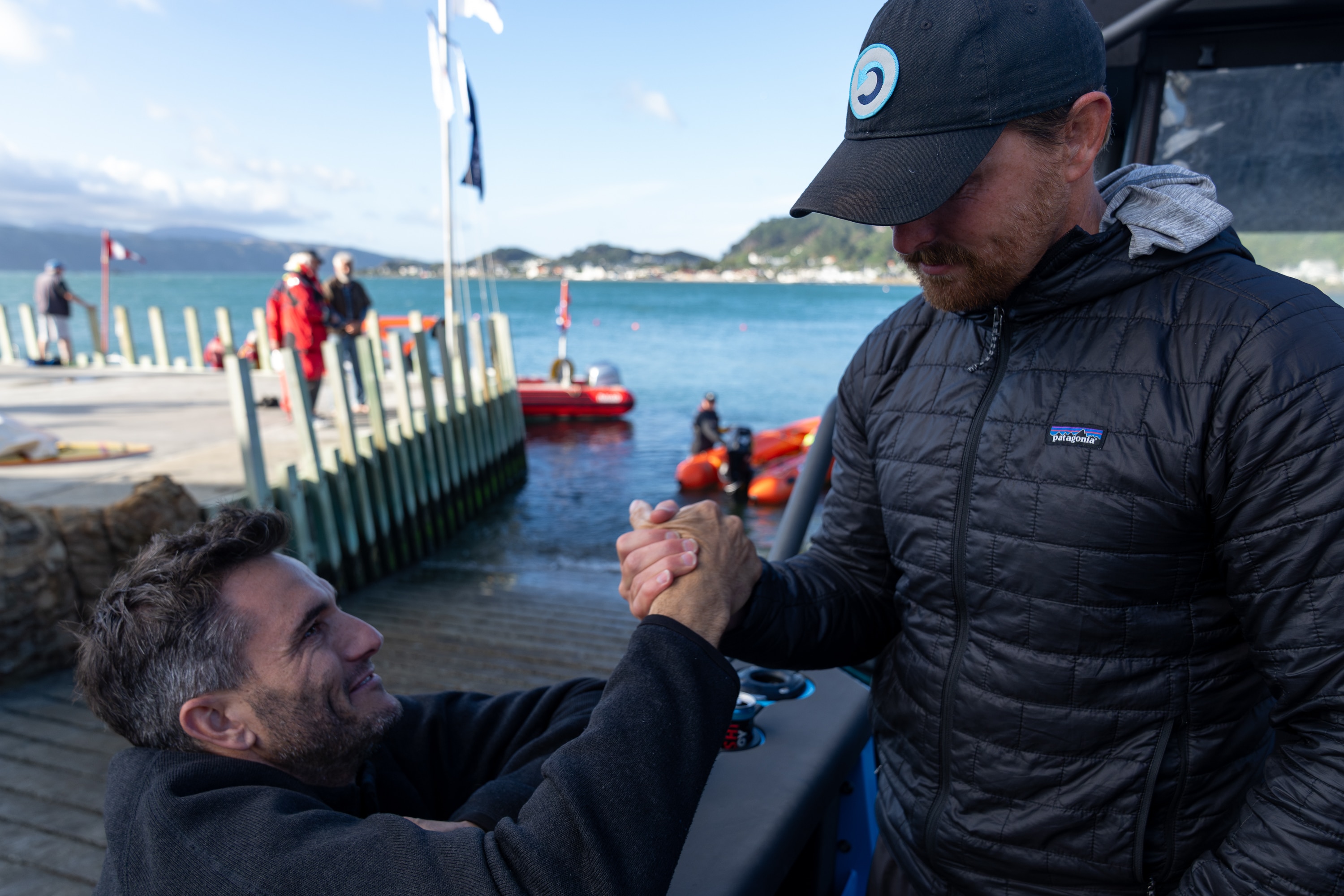 Jono Ridler shakes the hand of Blair Tuke