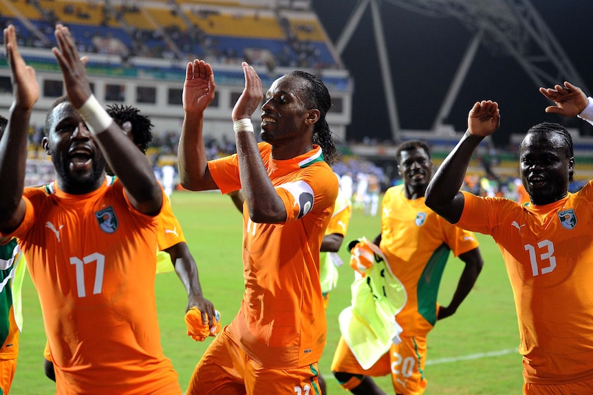 Ivory Coast players celebrate their win over Mali