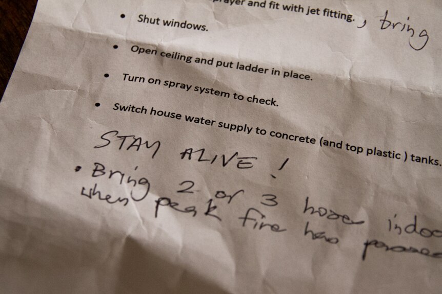 A typed fire plan on an A4 page, with STAY ALIVE! added to it in hand-written text.