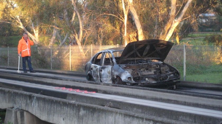 Burnt-out car on Adelaide busway