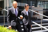 Catherine Atoms and Robert Cunningham walk out of the District Court in Perth.