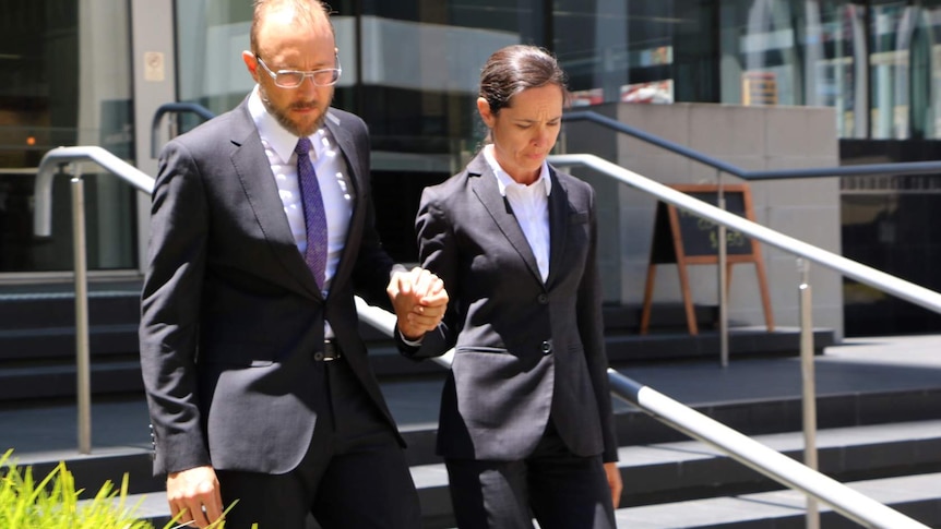 Catherine Atoms and Robert Cunningham walk out of the District Court in Perth.