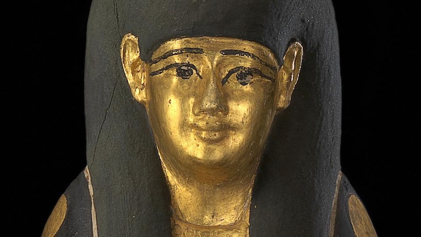 A golden mummy statue