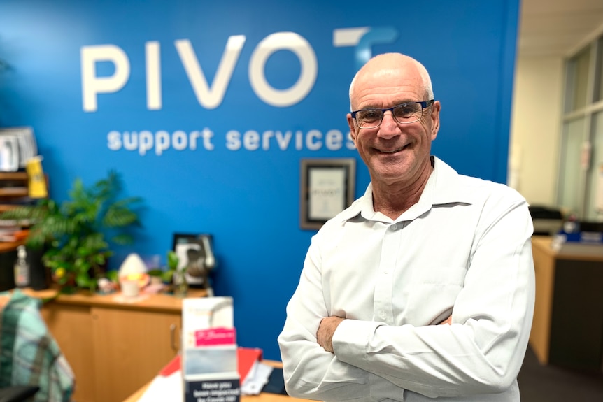 a man standing in an office