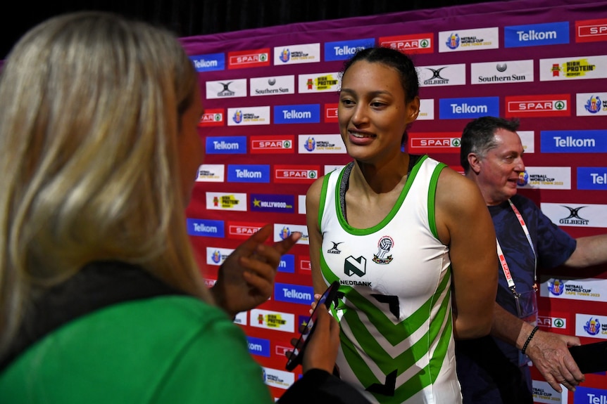 A Zimbabwe representative speaks to the media in the mixed zone at the Netball World Cup.